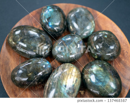 Exquisite collection of labradorite stones showcasing their stunning iridescence. Unique gemstones capture and reflect light 137468387