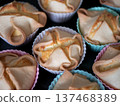 Deliciously baked soffioni pastries in colorful cupcake liners. Perfect sweet treats for special occasions 137468389