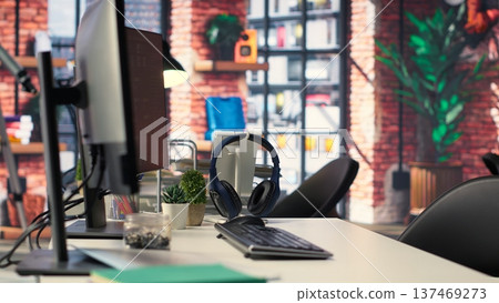 Empty office desk with computer screen showing terminal windows and network neurons. AI powered system uses cognitive computing and pattern recognition for futuristic software solutions. 137469273
