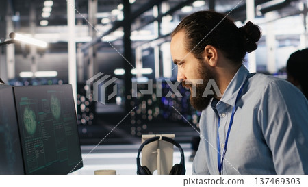 Employee requesting help from manager to fix hacked equipment systems. Stressed data center admin reacting to spyware popup on computer screen, launching emergency response protocol, camera A Employee requesting help from manager to fix hacked equipment systems. Stressed data center admin reacting to spyware popup on computer screen, launching emergency response protocol, camera A 137469303