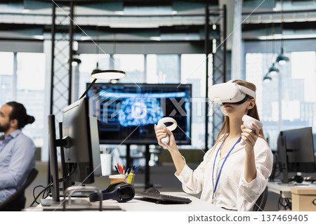Female engineer using virtual reality tech adjusting deep learning algorithms parameters to automate tasks. Intern wearing VR headset working with AI driven insights on notebook for code optimization Female engineer using virtual reality tech adjusting deep learning algorithms parameters to automate tasks. Intern wearing VR headset working with AI driven insights on notebook for code optimization 137469405