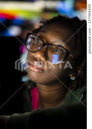 Woman looking at phone screen with dull expression, showing boredom and lack of motivation while using social media app. Person uninterested by social network clips on smartphone feed 137469409