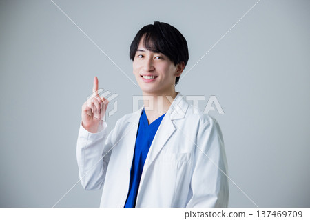 A young man wearing a white suit A young man wearing a white suit 137469709