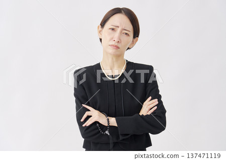 Angry woman in mourning clothes, white background 137471119