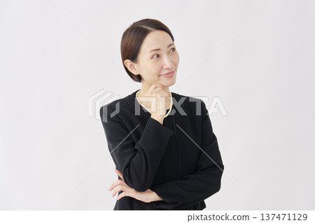 A woman in mourning clothes imagined on a white background 137471129