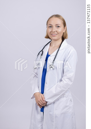 Female doctor with stethoscope looking at camera Female doctor with stethoscope looking at camera 137471135