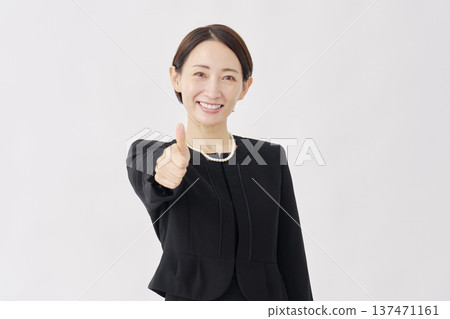 Woman in mourning clothes, good sign, white background 137471161