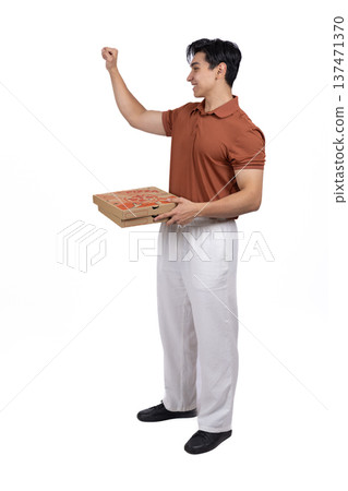 Young man walking with a laptop in his hand Young man walking with a laptop in his hand 137471370