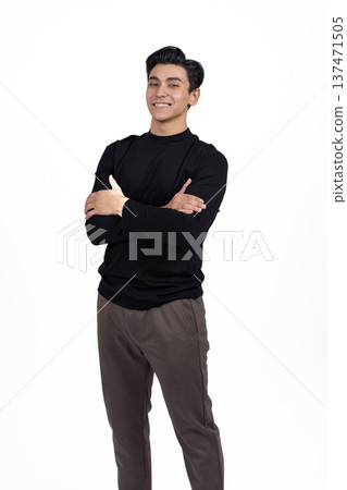 Young man in black t-shirt posing on white background in studio Young man in black t-shirt posing on white background in studio 137471505
