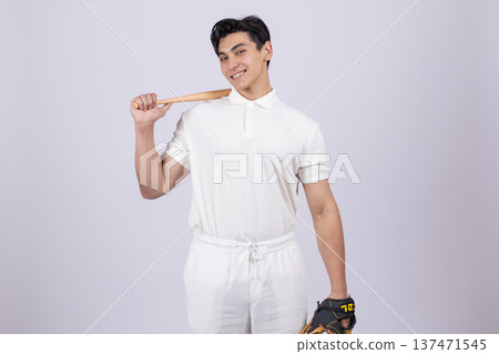Young man holding a baseball bat on his shoulder 137471545