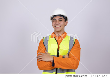 Male construction specialist in orange vest looking at camera 137471643