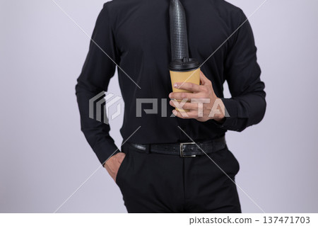 Confident man in black clothes holding a coffee cup 137471703