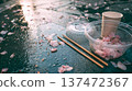 Garbage after cherry blossom viewing, cherry blossom petals and disposable containers, environmental issues, manners, fallen cherry blossoms, after the festival, copy space 137472367