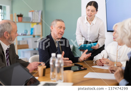 Girl secretary accompanies business negotiations and submit documents Girl secretary accompanies business negotiations and submit documents 137474299