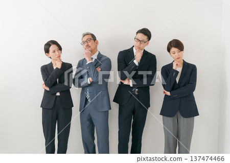 Four businessmen with worried expressions 137474466