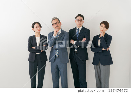 Four businessmen with worried expressions 137474472