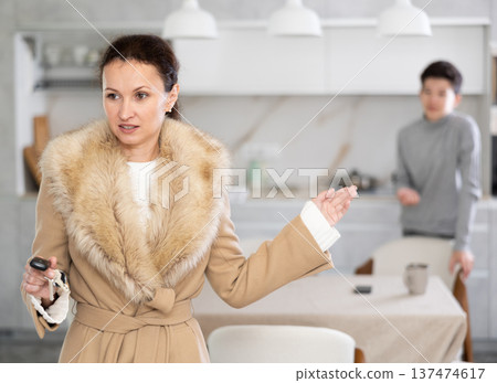 Mother leaving son home alone Mother leaving son home alone 137474617