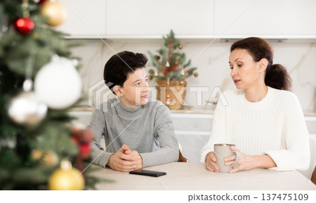 Mother and son discussing something 137475109