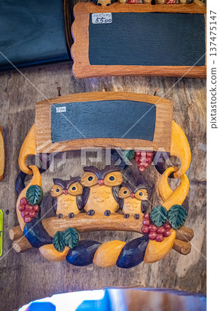 A view of woodcarving folk art and traditional crafts lined up at Ainu Kotan in Akan, Hokkaido 137475147