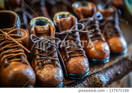 A view of woodcarving folk art and traditional crafts lined up at Ainu Kotan in Akan, Hokkaido 137475190