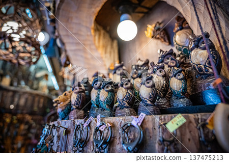 A view of woodcarving folk art and traditional crafts lined up at Ainu Kotan in Akan, Hokkaido A view of woodcarving folk art and traditional crafts lined up at Ainu Kotan in Akan, Hokkaido 137475213