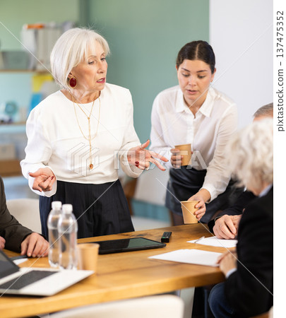 Senior female speaker share sad news or gives reprimands, criticizes employees Senior female speaker share sad news or gives reprimands, criticizes employees 137475352