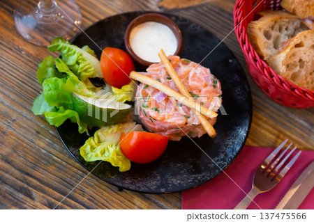 French appetizer salmon tartare with onion cream 137475566