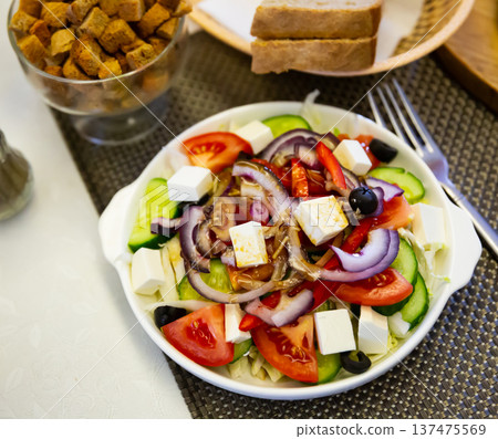 Fresh colorful Greek salad (horiatiki salad) with feta cheese Fresh colorful Greek salad (horiatiki salad) with feta cheese 137475569
