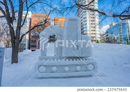 Large snow sculptures at the Sapporo Snow Festival towering under the blue sky (Sapporo, Hokkaido) 137475643