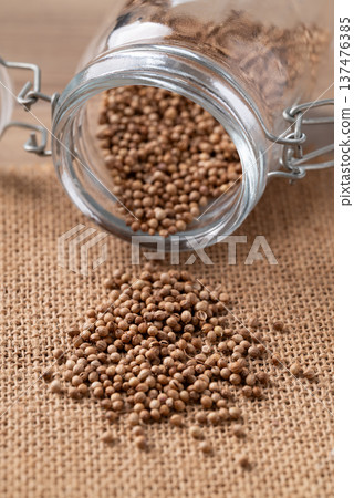 Coriander seeds in a glass jar, Thai food ingredients Coriander seeds in a glass jar, Thai food ingredients 137476385