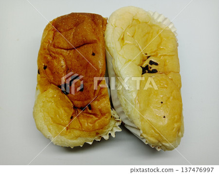 two loaves of bread with chocolate sprinkles topping two loaves of bread with chocolate sprinkles topping 137476997
