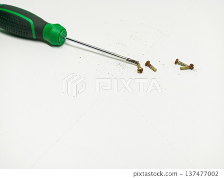 Screwdriver and screws carpentry tools background Screwdriver and screws carpentry tools background 137477002
