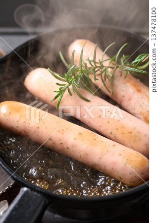 Heating the herb sausage Heating the herb sausage 137478100