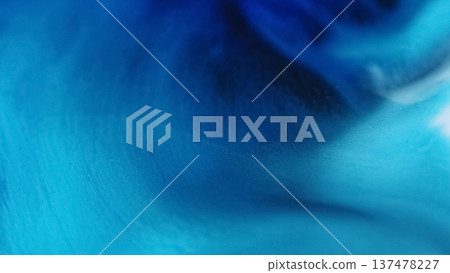 Defocused blue paint. Color water flow. Bright liquid pigment vibrant acrylic fluid swirl texture floating on abstract art background. Defocused blue paint. Color water flow. Bright liquid pigment vibrant acrylic fluid swirl texture floating on abstract art background. 137478227