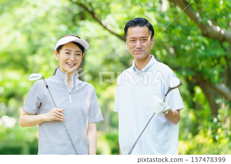 Senior couple playing golf Senior couple playing golf 137478399