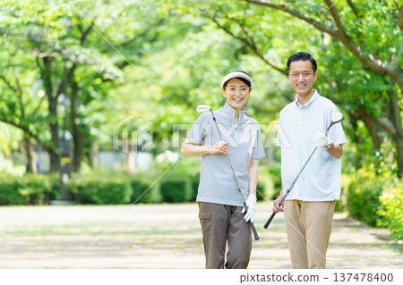 Senior couple playing golf Senior couple playing golf 137478400