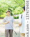 Senior couple with golf clubs 137478408