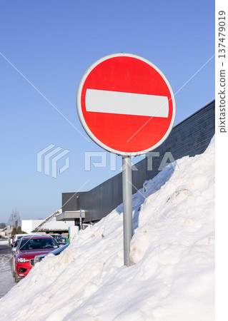 No Entry Road Sign Buried In Massive Snowbank During Winter No Entry Road Sign Buried In Massive Snowbank During Winter 137479019