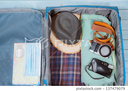 top view with protective mask and accessories prepare in luggage for travel with new normal style 137479079