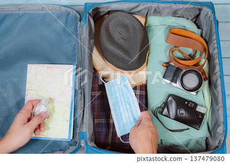 top view with protective mask and accessories prepare in luggage for travel with new normal style 137479080
