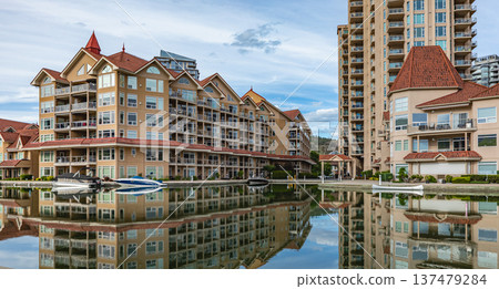 Facade of a modern luxury hotel. Resort Waterfront park and residential area in a city Facade of a modern luxury hotel. Resort Waterfront park and residential area in a city 137479284