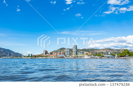 A view of the Kelowna Skyline and Okanagan Lake British Columbia Canada in the sunny summer day. 137479286