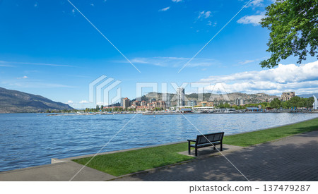 A view of the Kelowna Skyline and Okanagan Lake British Columbia Canada in the sunny summer day. A view of the Kelowna Skyline and Okanagan Lake British Columbia Canada in the sunny summer day. 137479287