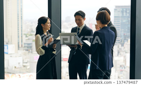 Group of business people having a conversation in the lobby Group of business people having a conversation in the lobby 137479487