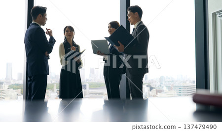 Group of business people having a conversation in the office Group of business people having a conversation in the office 137479490