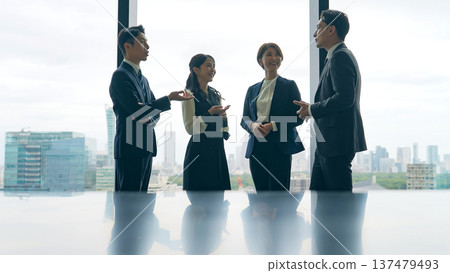 Group of business people having a conversation in the office 137479493