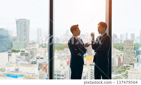 Group of business people having a conversation in the lobby 137479504