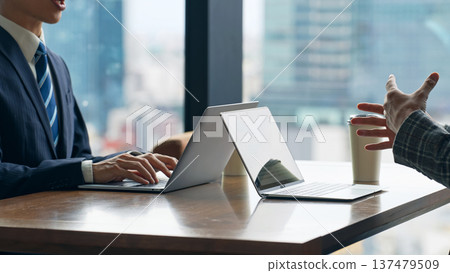 Group of casual business people meeting in an office 137479509