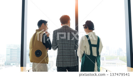 Store staff, designers, and workers meeting at a store facility Store staff, designers, and workers meeting at a store facility 137479541