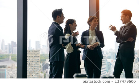 Group of business people having a conversation in the office Group of business people having a conversation in the office 137479600